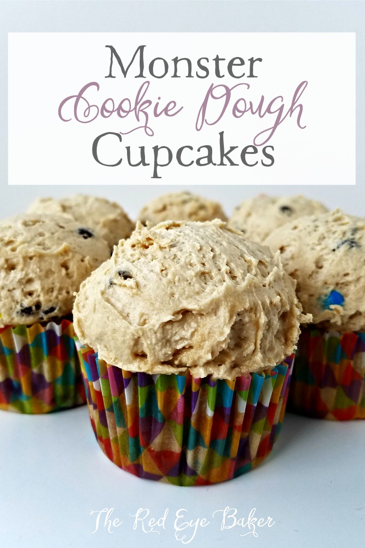 Monster Cookie Dough Cupcakes | Bring out the kid in you with these delicious Monster Cookie Dough Cupcakes, filled with edible cookie dough, M&M's, chocolate chips, and PB frosting!